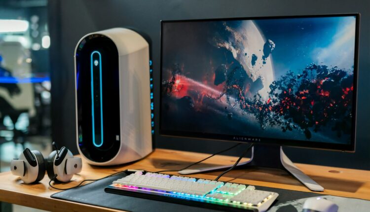 black flat screen computer monitor beside white computer keyboard