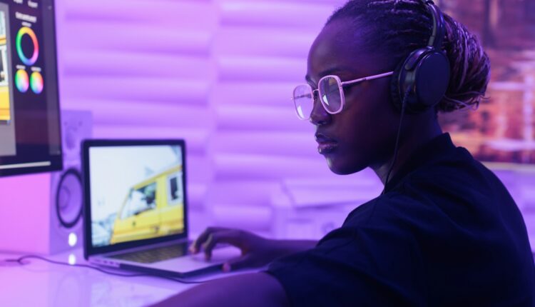 A woman sitting at a desk in front of a computer