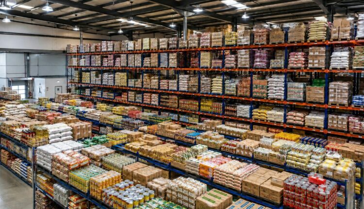 A large warehouse interior filled with shelves of packaged goods